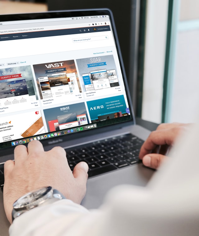 Website design mockups displayed across a laptop and tablet