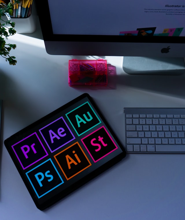 Designer reviewing brand identity concepts on a desk with swatches and print samples